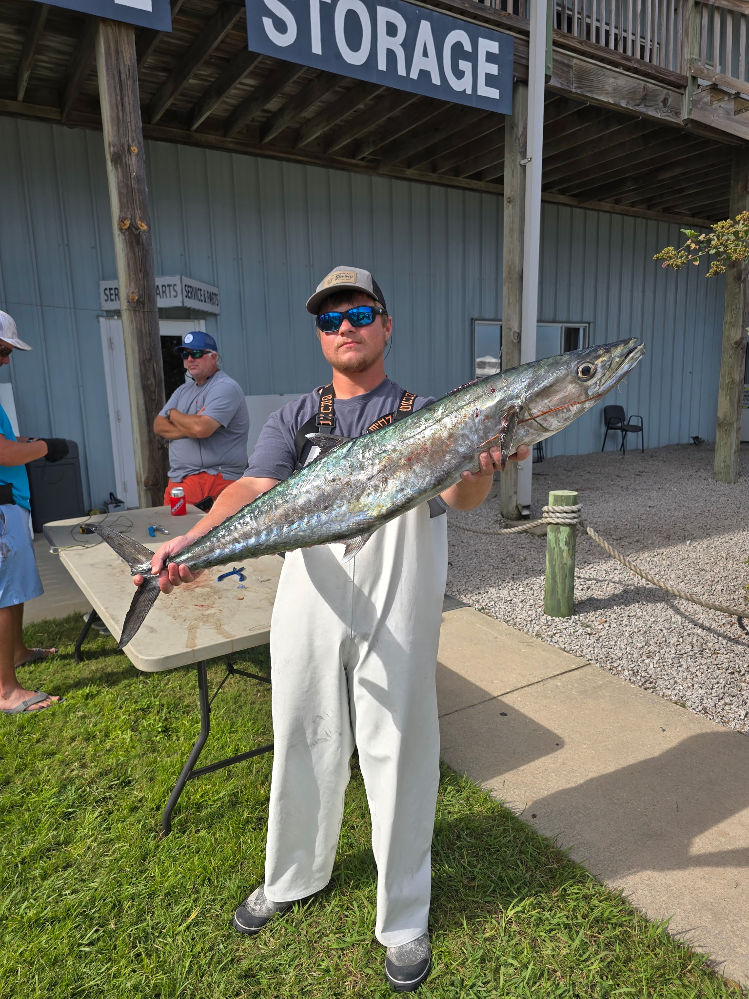 Angler with king mackerel at weigh-in